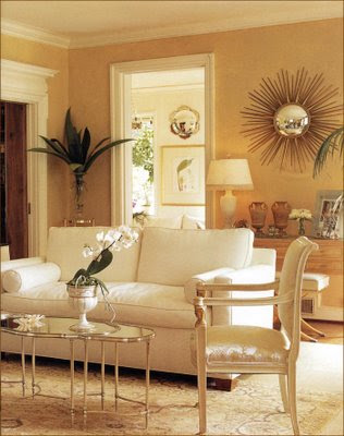 ... frequently uses mirrored coffee tables for their glamorous touch
